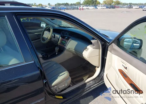 2002 Toyota Avalon Xls z USA, uszkodzony, nr VIN 4T1BF28B82U207431